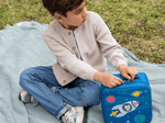 Child playing with Toniebox, Tonies, and Carrying Case Max for Tonies - Blast Off