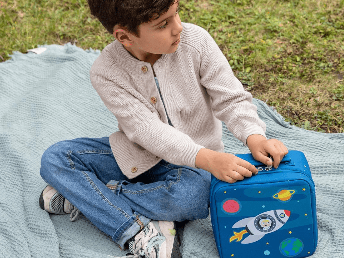 Child playing with Toniebox, Tonies, and Carrying Case Max for Tonies - Blast Off