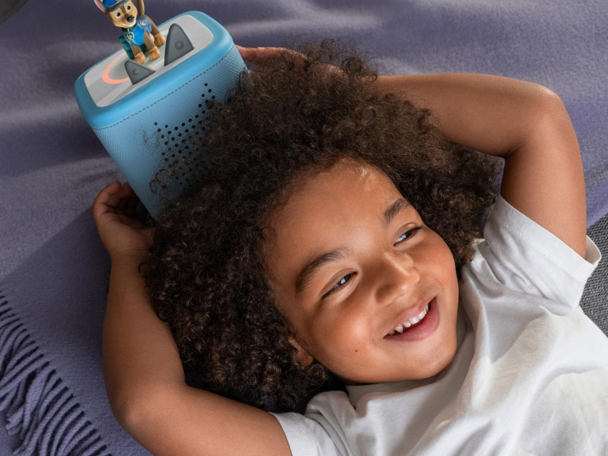 Child Playing With Blue Toniebox 2, An Audio Player For Kids With Chase Audio Figurine