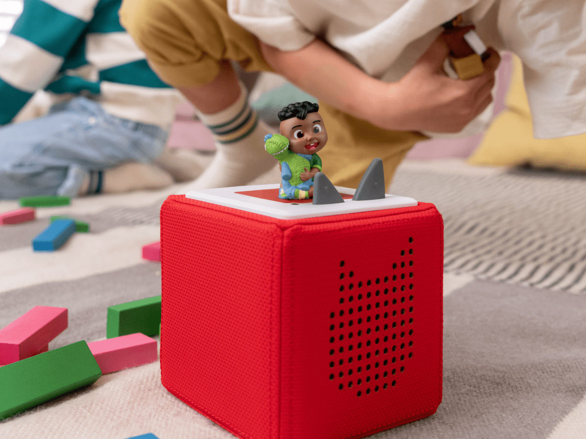 Child Playing With Cocomelon- Cody Audio Figurine And Toniebox 2