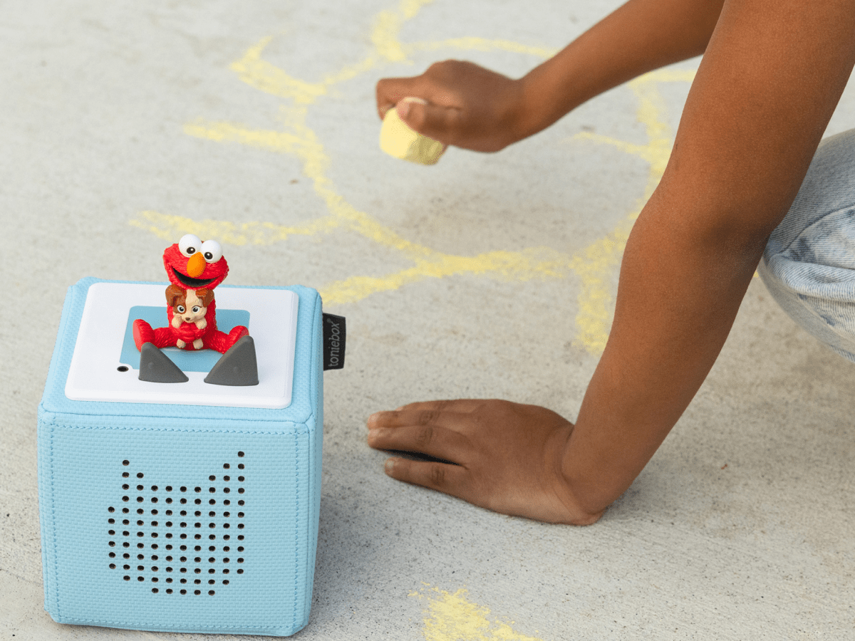 Child playing with Sesame Street: Elmo & Tango Tonie