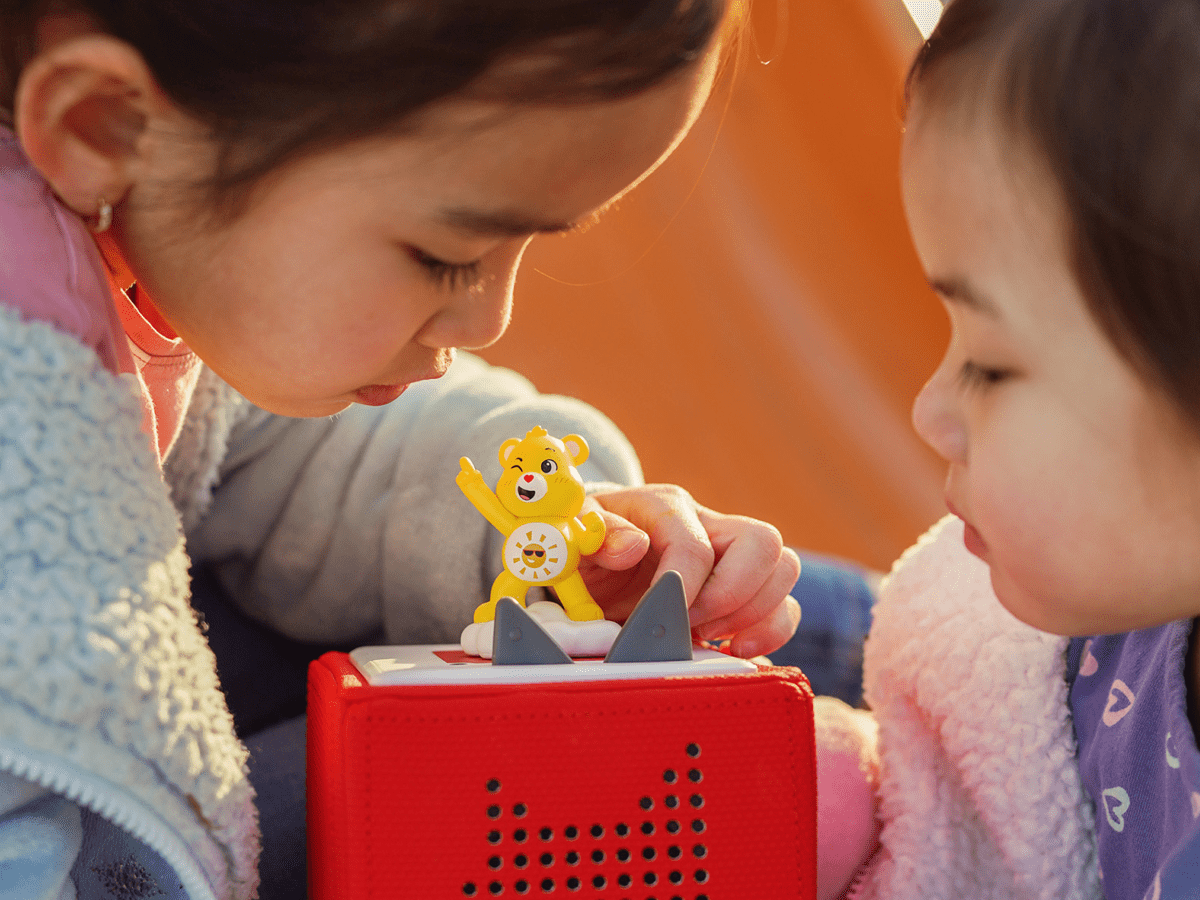 Child Playing With Care Bears: Funshine Bear Tonie