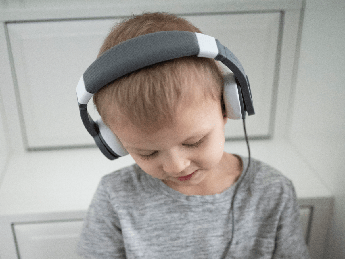 Child Using The Toniesâ® Gray Wired Headphones For Kids