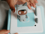 Child Playing With Gray With Dark Hue Creative-Tonie
