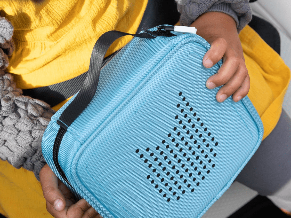 Child Holding Tonies Carrying Case