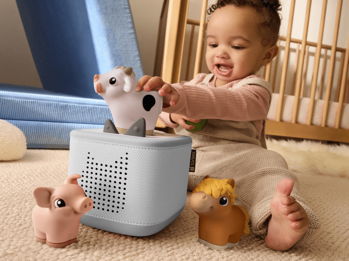 child playing with toniebox 2 and my first tonies horse, cow and pig