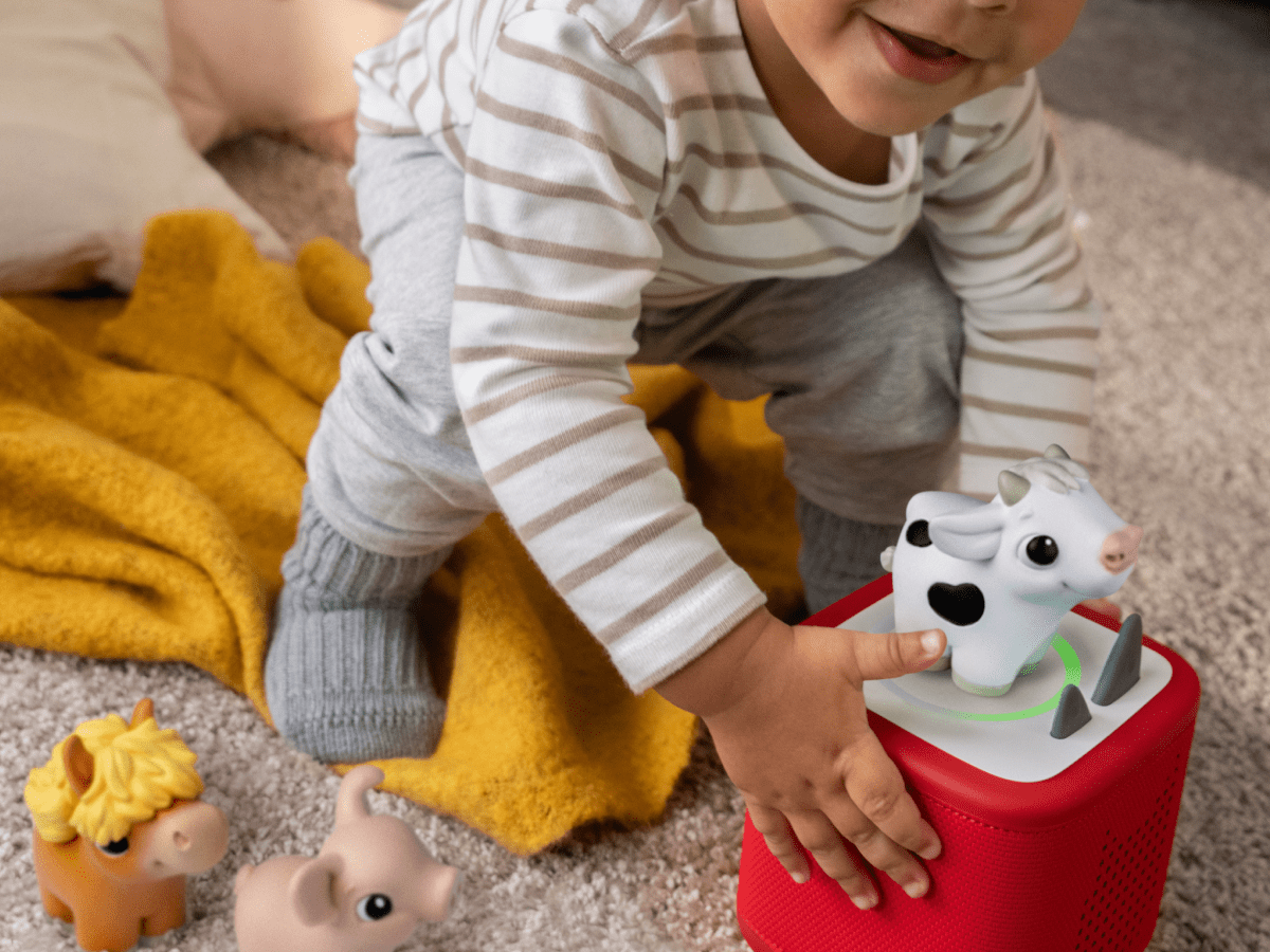 Child playing with my first tonie cow audio figurine and Toniebox 2