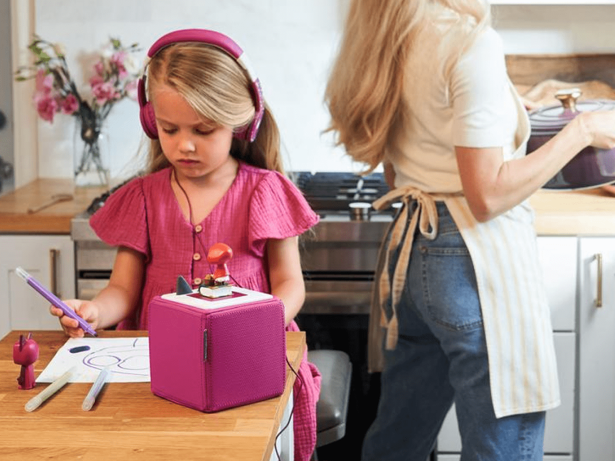 Child using with Purple Headphones for Kids