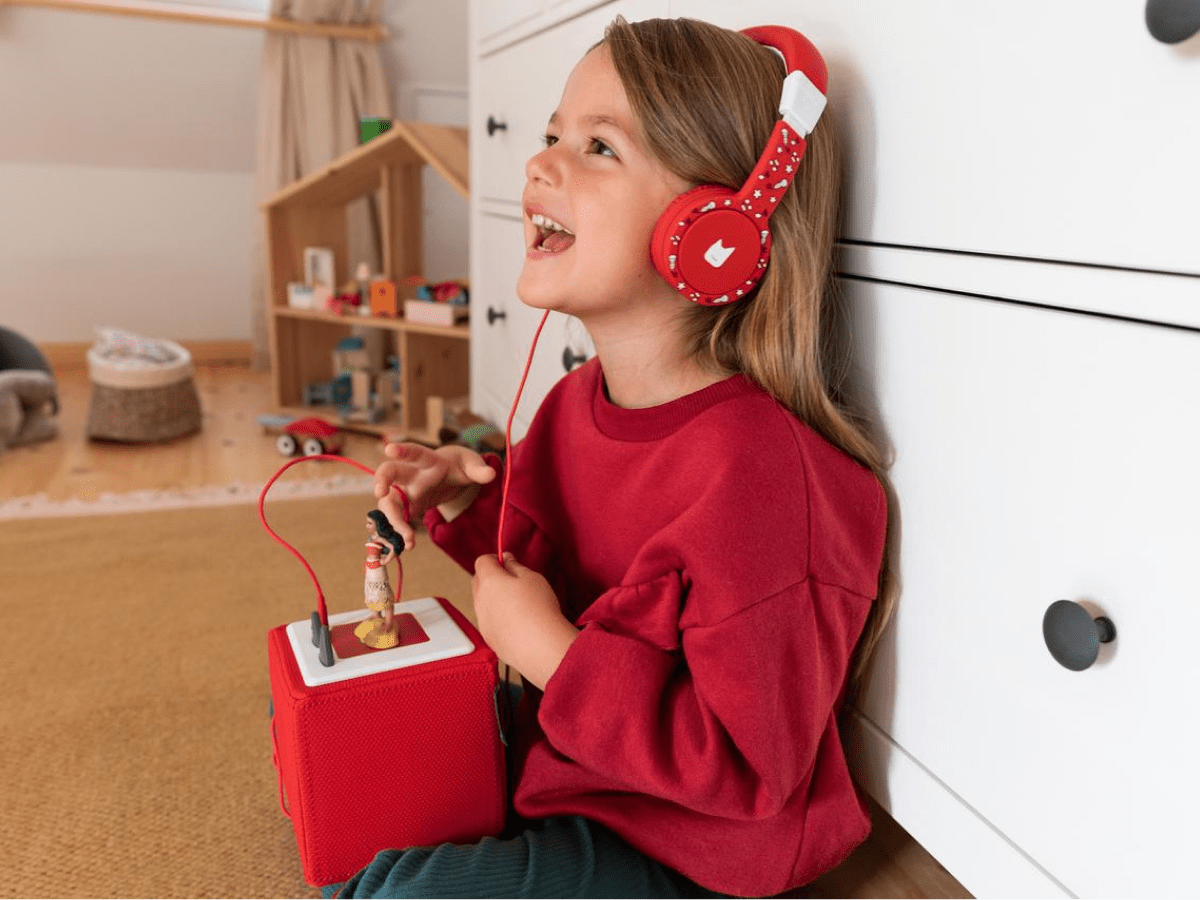 Child using with Red Headphones for Kids