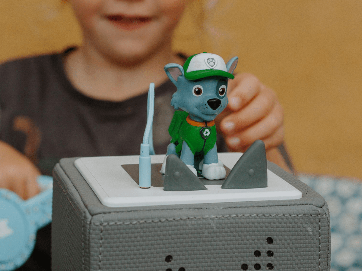Child Playing With Rocky Tonie Audio Figurine And Toniebox 2