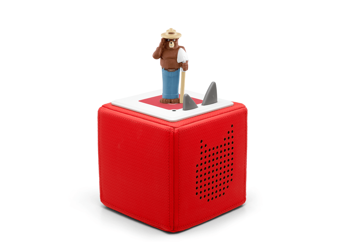 Full view of a Smokey Bear Tonie on a red Toniebox