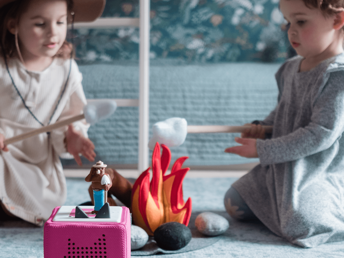 Child Playing With Smokey Bear Tonie
