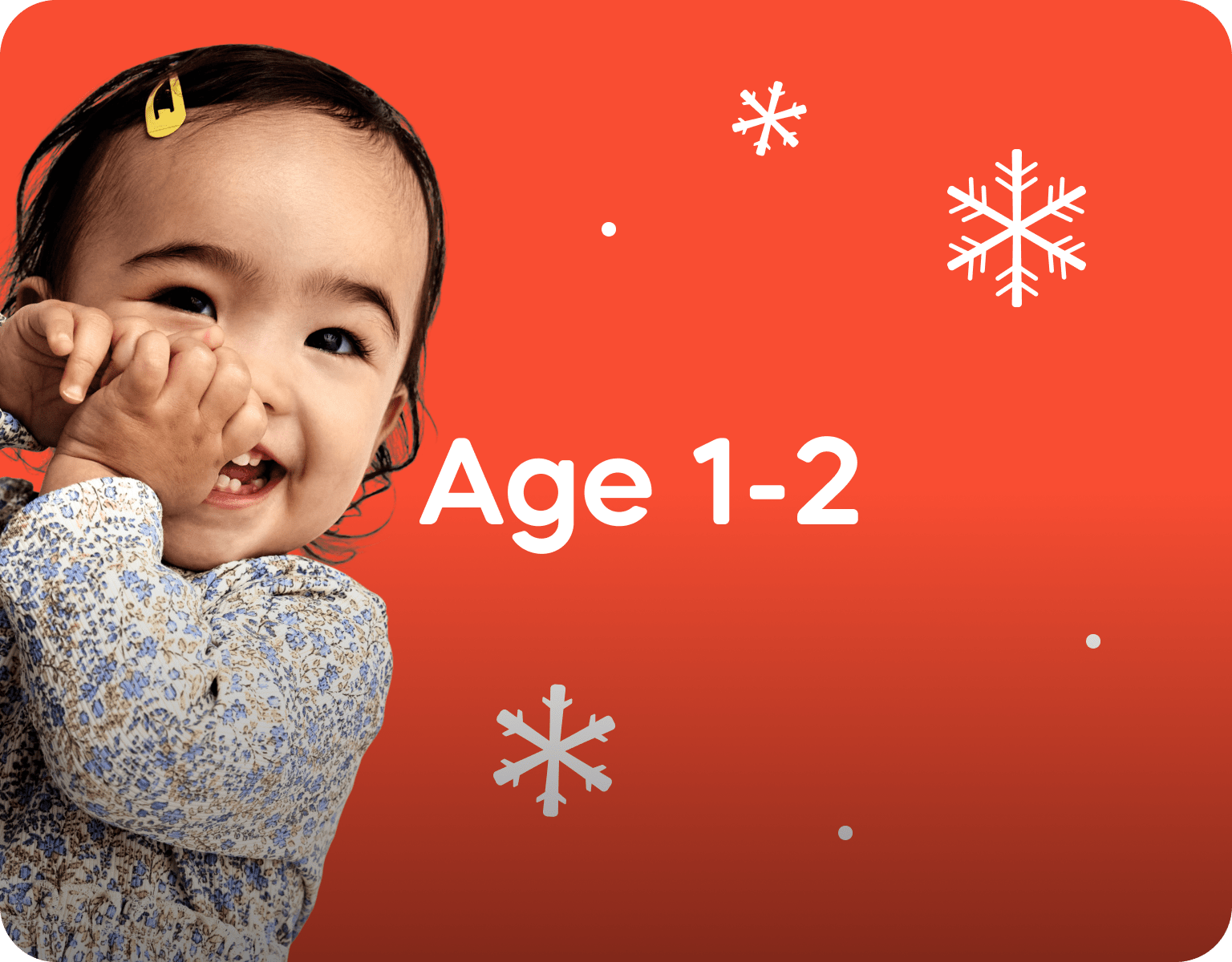 Child with 'Age 1-2' text on a red background with snowflakes