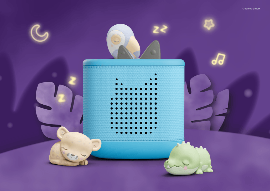 Sleepy Toucan Tonie on a blue Toniebox 2 with the Sleepy Jaguar and Sleepy Crocodile Tonies near them