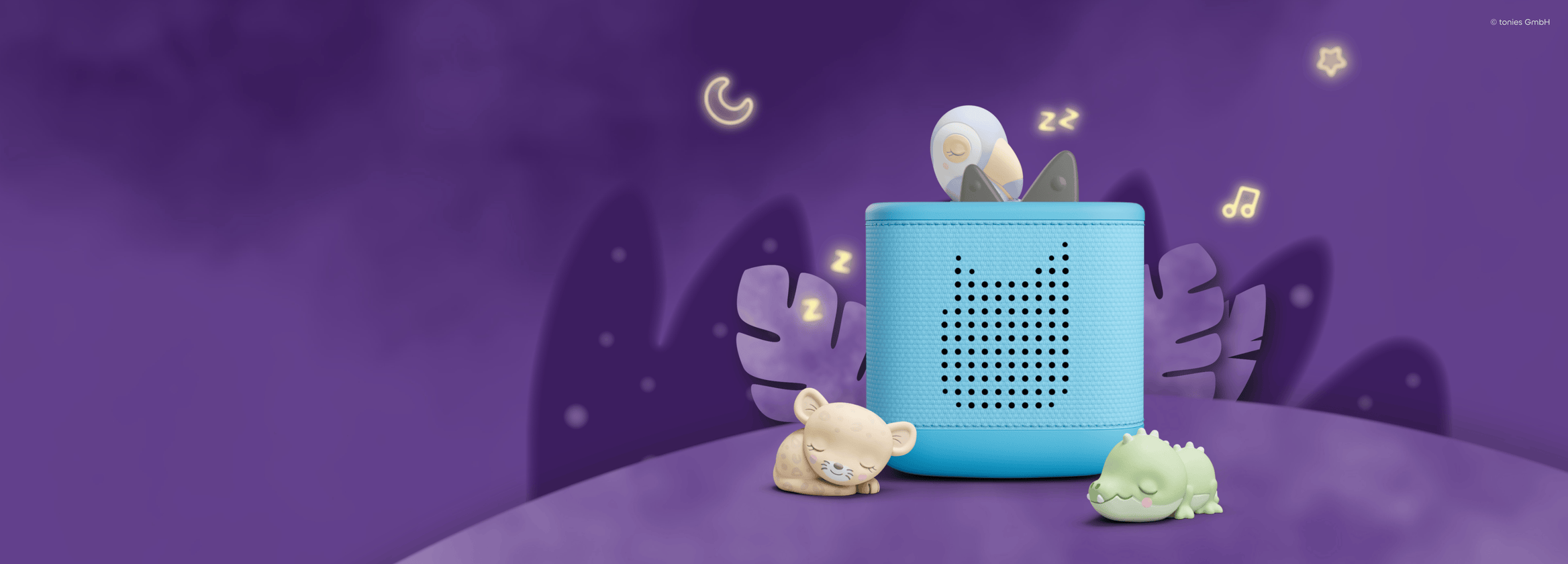 Sleepy Toucan Tonie on a blue Toniebox 2 with the Sleepy Jaguar and Sleepy Crocodile Tonies near them