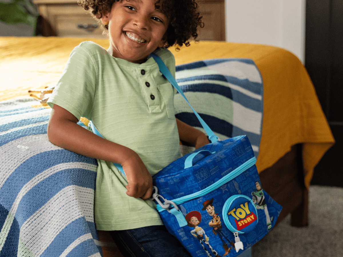 Child Playing With The Listen & Go Bag - Toy Story