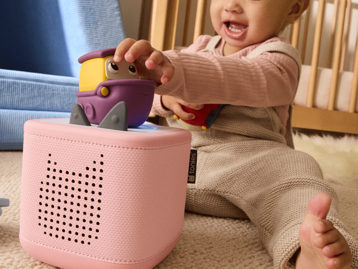 Child playing with my first tonie travel set boat audio figurine and Toniebox 2