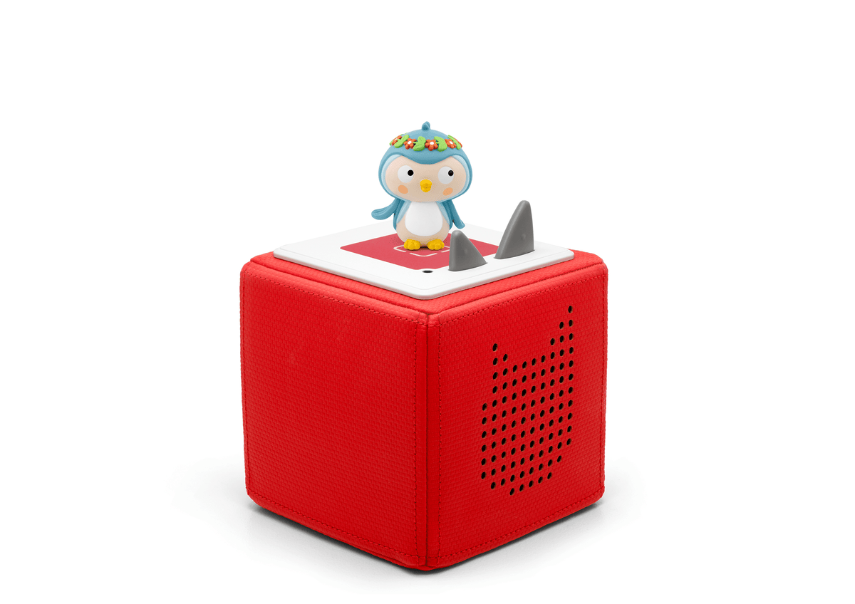Full view of a Spanish Traveling Songs Tonie on a red Toniebox
