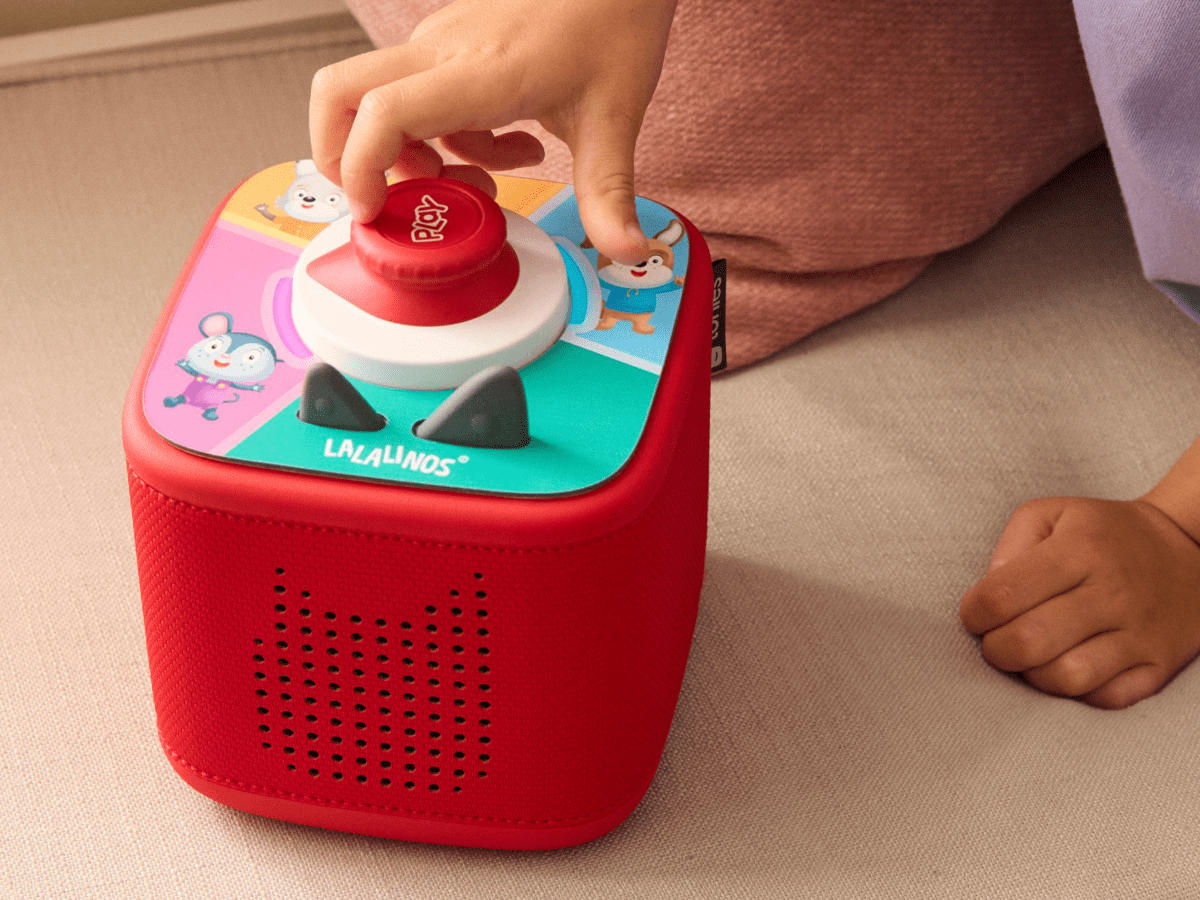 child playing with Lalalinos: Your Day in Bumbaloo - ToniePlay Game and tonieplay controller