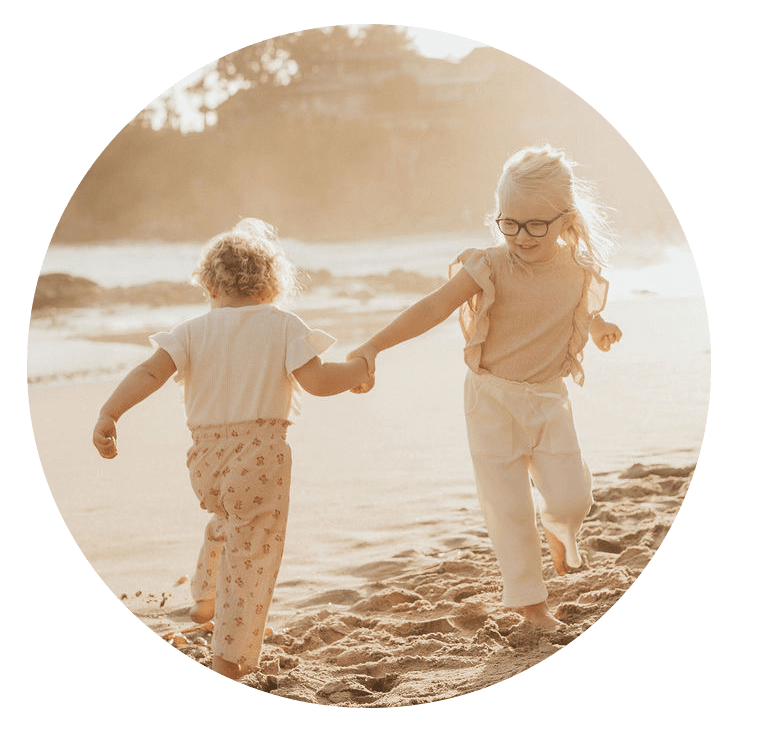 Two children playing on the beach