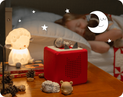 Child fast asleep with the sleepy friend tonies and night light