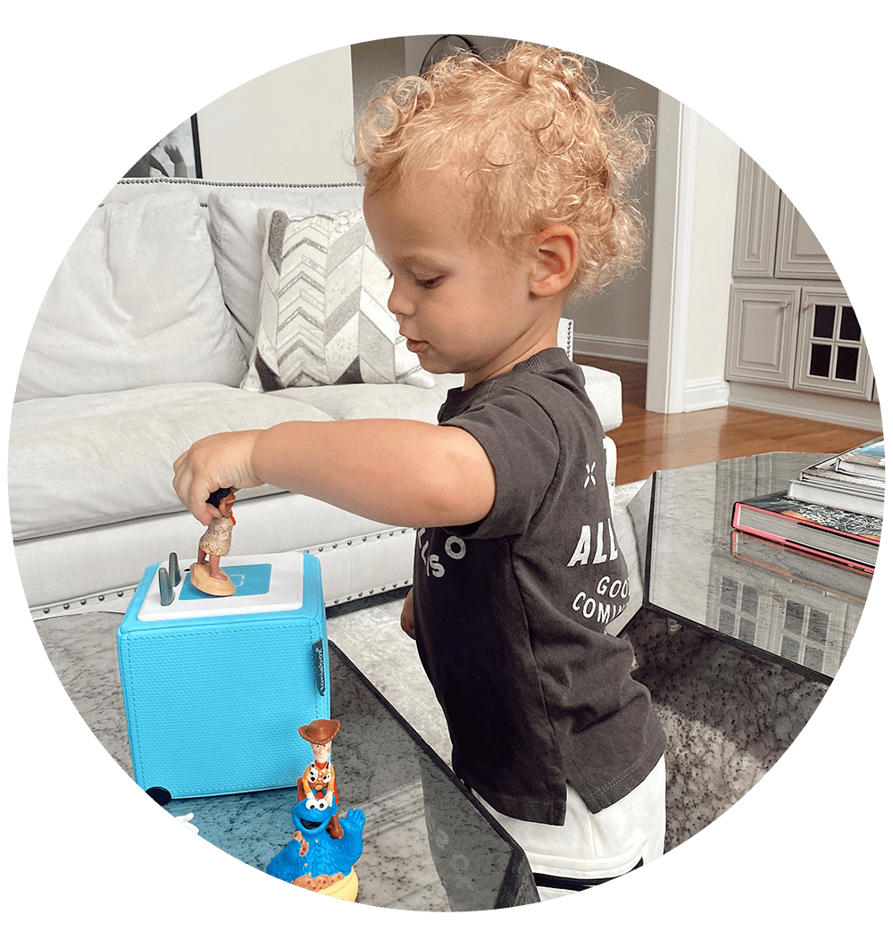 Toddler playing with Moana Tonie on the Toniebox