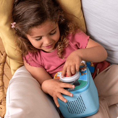 child playing Tonieplay Game with sky blue Toniebox 2