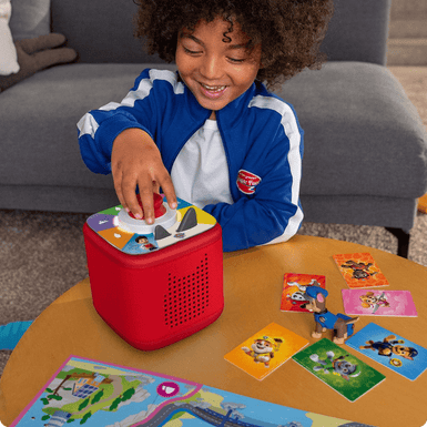 child playing PAW Patrol Tonieplay game with Tonieplay Controller on a red Toniebox 2