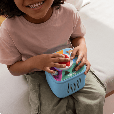 child playing lalalinos Tonieplay game with a sky blue Toniebox 2
