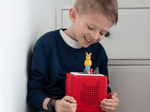 Child playing with Arthur Tonie audio figurine and Toniebox 2