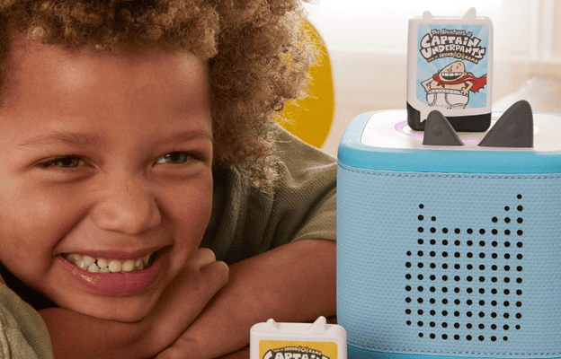 Child listening to Captain Underpants Audiobooks for kids on a blue Toniebox 2