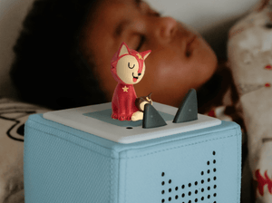 Child playing with Favourite Children's Songs: Bedtime Songs Tonie audio figurine and Toniebox 2