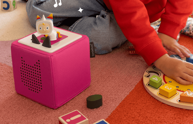 Child listening to a Creative-Tonie while enjoying playtime