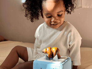 Child Playing With Brown Bear & Friends Tonie