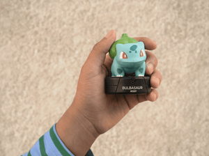 child holding the Pokémon Bulbasaur Tonie