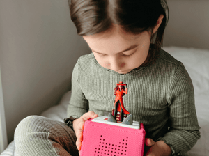 Child Playing With Carmen Sandiego Tonie