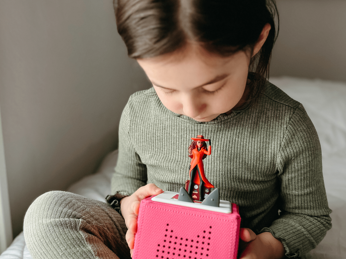 Child Playing With Carmen Sandiego Tonie