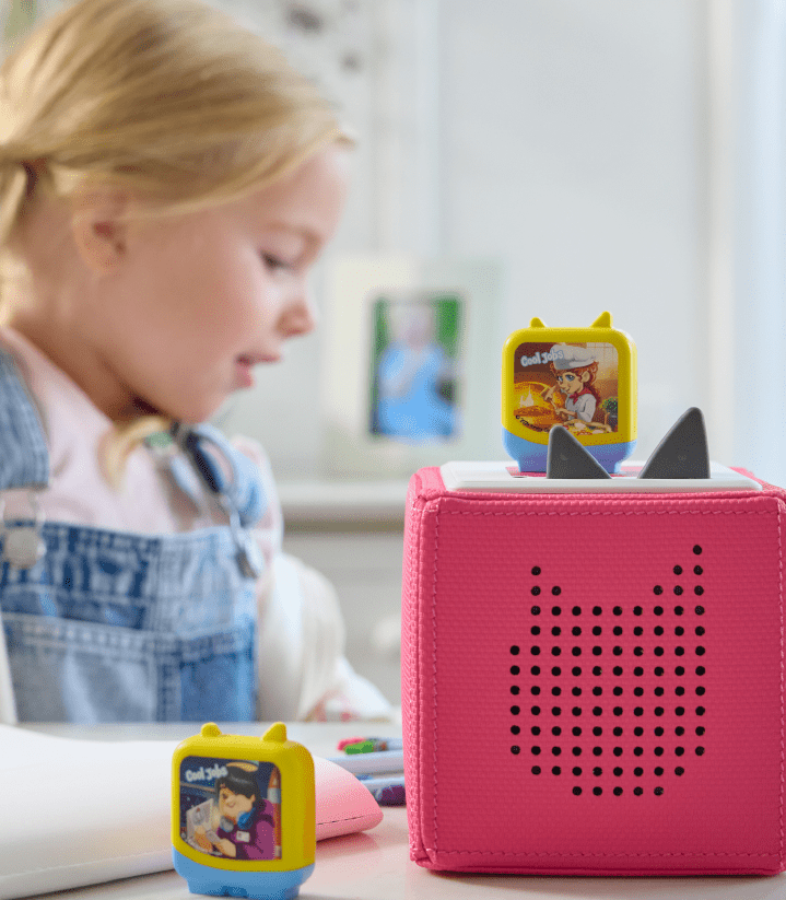 Girl listening to Clever Tonies to spark imagination while learning