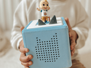 Child Playing With Cocomelon: Sing-Along Favourites Tonie