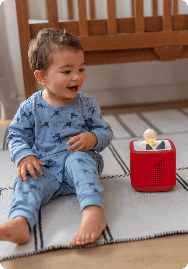 child listening to sleepy friends duck tonie on red toniebox 2