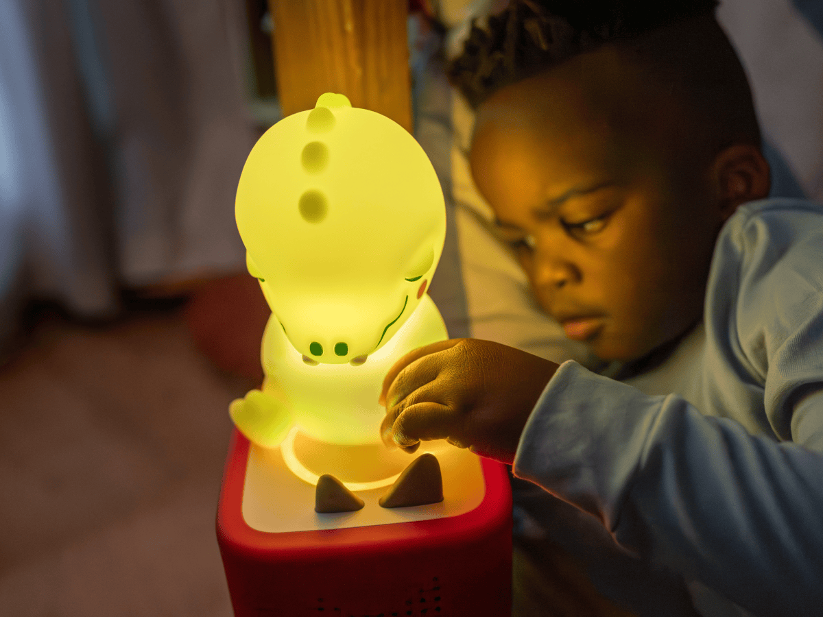 	
Child playing with Sleepy Friends- Sleepy Crocodile Night Light  Tonie audio figurine and Toniebox 2