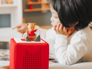 Child Playing With Daniel Tiger'S Neighborhood Tonie