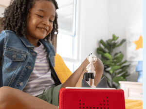 Child Playing With Diary Of A Wimpy Kid Tonie