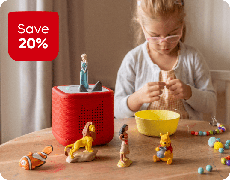 Little girl during craft time with a red Toniebox 2 and Disney Tonies