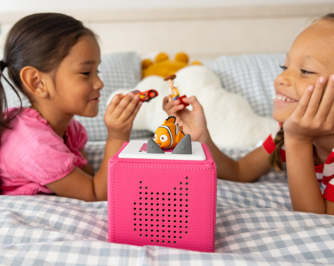 children playing inside with tonies and a pink toniebox