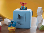 Child playing with Sesame Street: Elmo Tonie