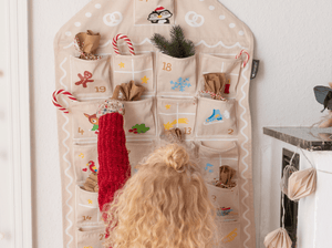 Child Playing With The Gingerbread Advent Calendar And Tonies