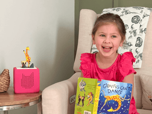 Child Playing With Giraffes Can'T Dance Tonie