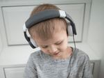 Child Using The Toniesâ® Gray Wired Headphones For Kids