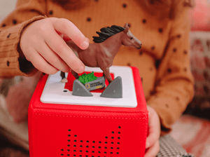 Child Playing With National Geographic Kids: Horse Tonie